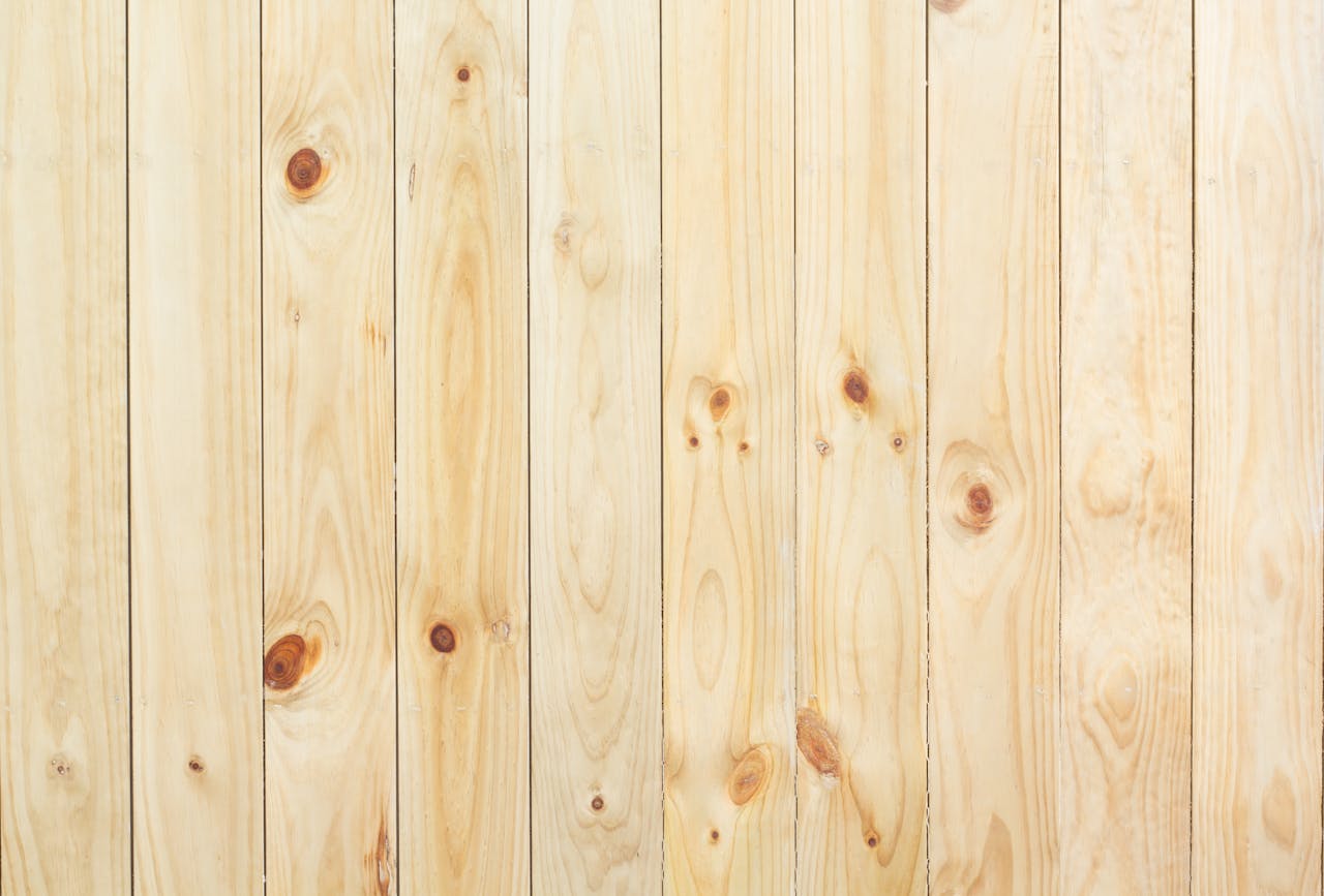 Close-up of natural wood plank texture, ideal for backgrounds and design.